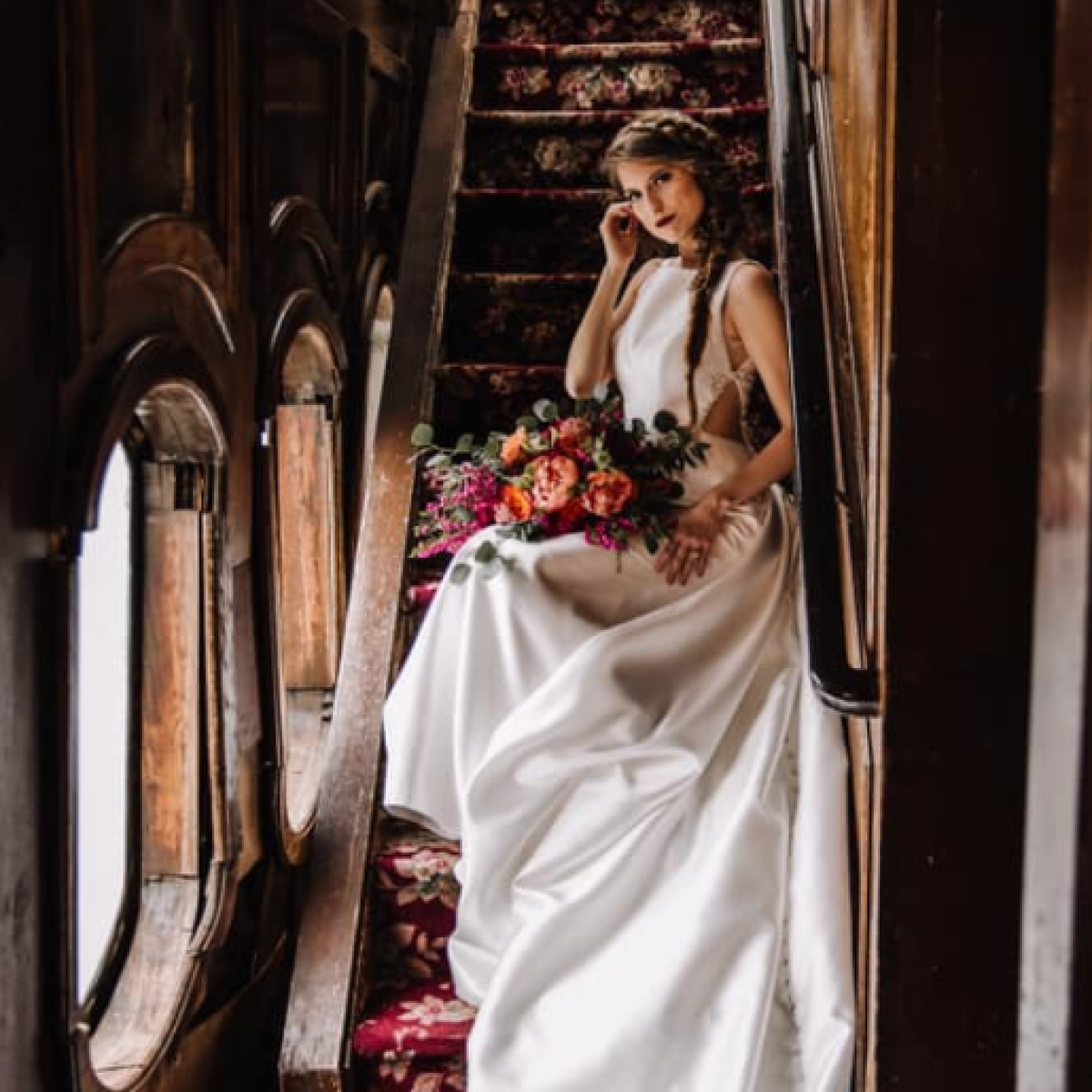Woman in wedding dress on steps