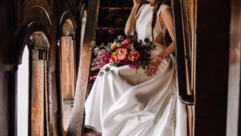 Woman in wedding dress on steps