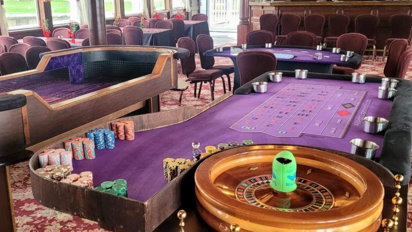 a room filled with furniture and vase of flowers on a table