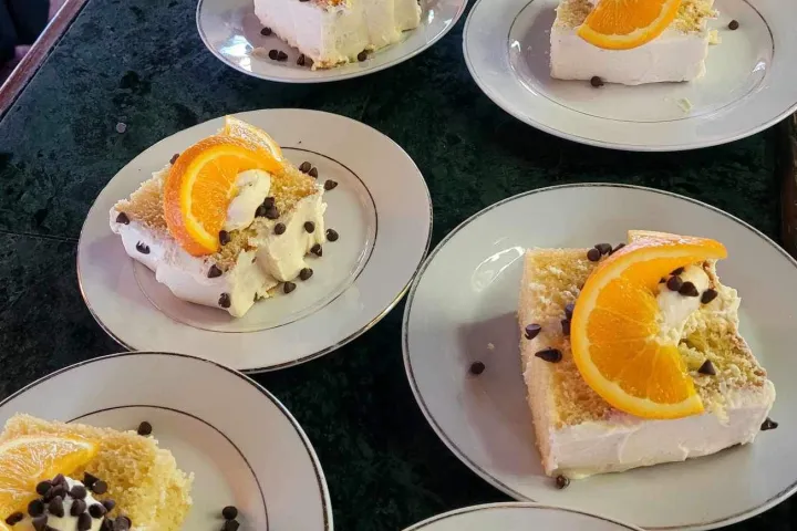 a plate full of breakfast food is sitting on a table