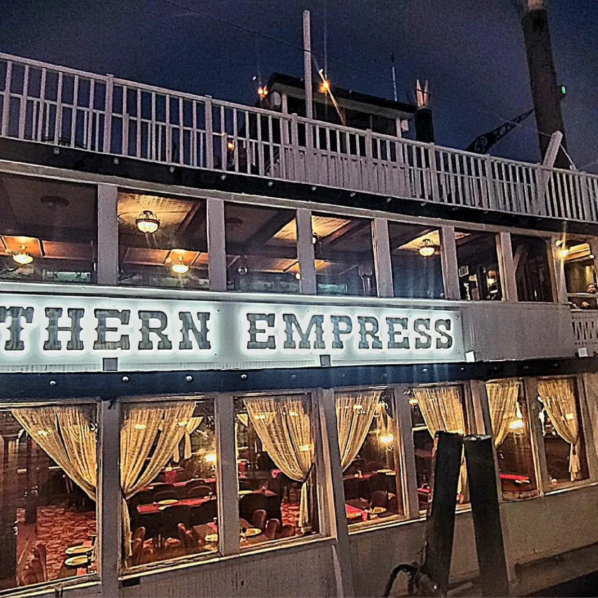 a sign on an awning on the side of a building