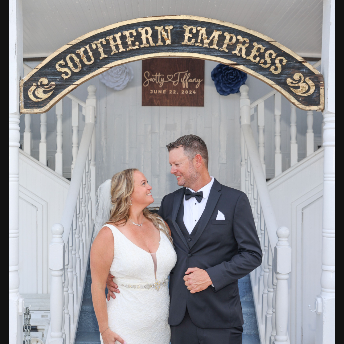 a man and a woman standing in front of a building